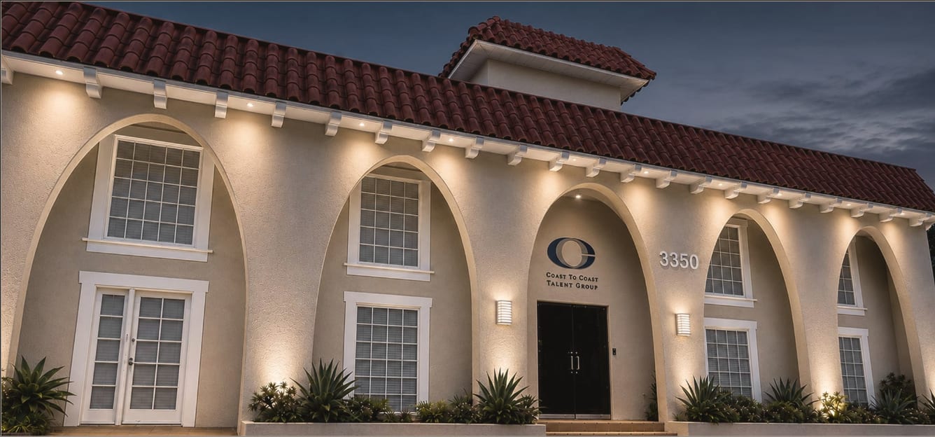 The Coast to Coast Talent Group building at 3350 Barham Boulevard at dusk